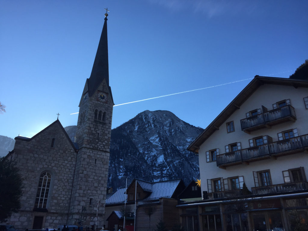 church and mountain view in hallstatt, austria